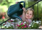 WaterFlowersGirl copy  Fiona Boettner, 4, helps her mom water the plants and flowers at their home in Spartanburg Monday evening, 4-24-06.   (NOTE: Stand-alone FEATURE)
